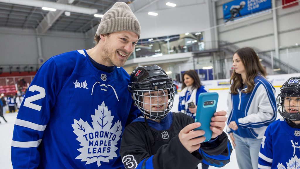A boy takes a selfie with #22